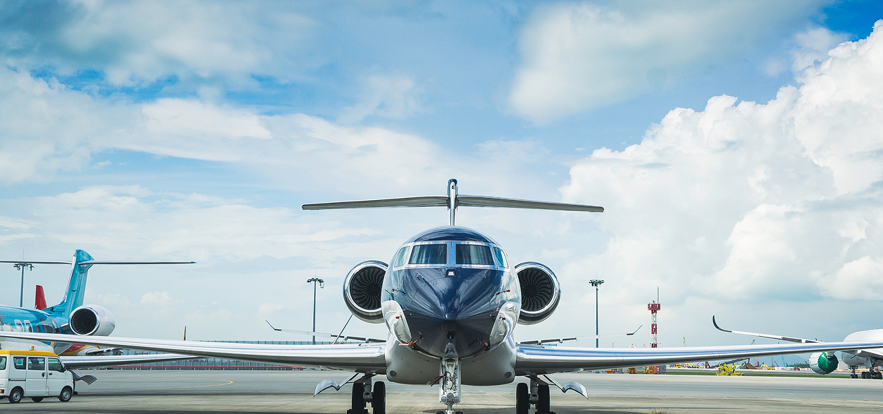 image of a luxury private jet against a blue sky